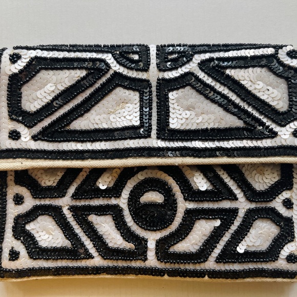 Handbags - A sequence clutch with chain